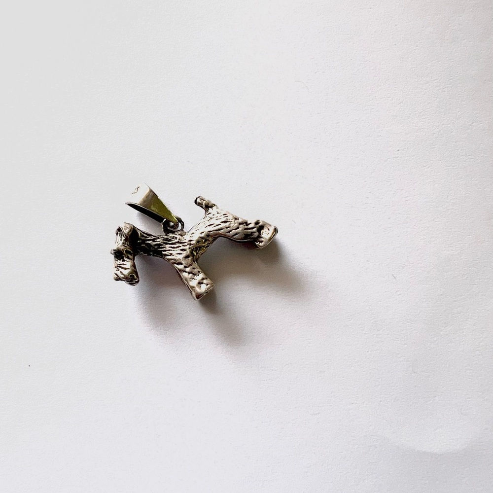 Silver Dog charm.